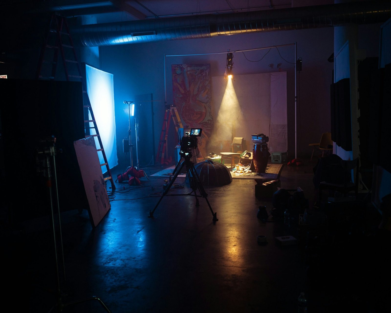 A dark room with a camera and lights